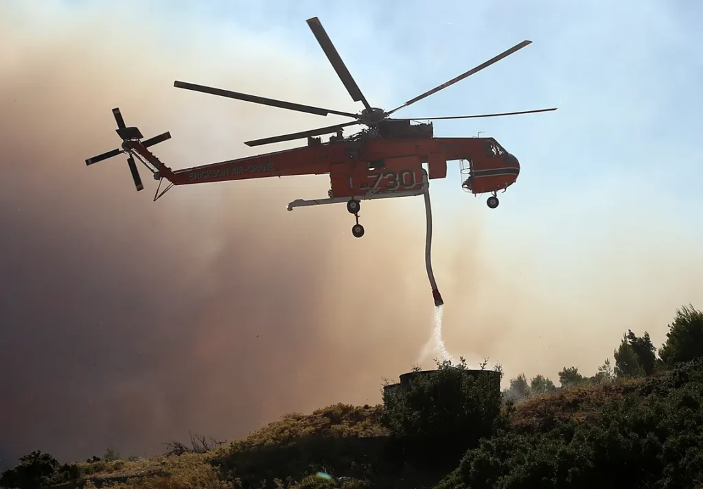 Helicopters Crash Battling Greek Wildfires, Evacuations Underway